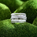Wide multi-layer silver ring with micro-paved cubic zirconia crystals in interlocking design - US 6 / Platinum Color White Zirconia