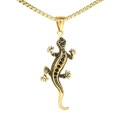 Detailed view of golden gecko pendant with black stones and textured metal limbs - Single Pendant Gold