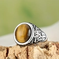 Macro shot of men's tiger eye ring with tree of life relief on silver band - US 7 / Steel Tiger Eye
