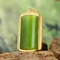 Macro detail of a rectangular green stone pendant with gold bezel on natural bark texture - Gold Frame Cyan Pendant Only (Without Chain) (HFD9000)