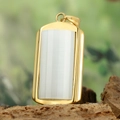 Detailed view of a gold rectangular pendant with white vertical striped stone on wood - Gold Frame White Pendant Only (Without Chain) (HFD9000)