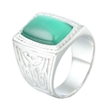 Macro detail of silver stainless steel ring with green gemstone and tribal engravings - Silver With Green Zircon