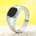 Macro shot of silver signet ring with square black agate inlay on white stone base - US 7 / Steel Black