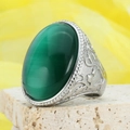 Vintage silver ring featuring a large oval green cat-eye stone with floral embossing - US 7 / Steel-Green