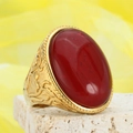 Retro gold ring featuring a large oval red gemstone and embossed vine patterns - Gold Wine Red