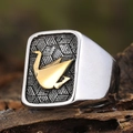 Minimalist stainless steel ring with golden origami paper crane relief on a textured surface - US 7 / Two-tone