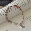 Multicolor braided S925 silver Good Luck charm bracelet on vintage book background - Multicolored Braided Good Luck Tag (1SL61-SG) / 925 Silver