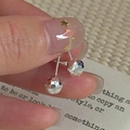 Handheld view of S925 sterling silver drop earrings with faceted CNC geometric metal balls - 6MM Faceted Double Ball Drop (EHK105) / 925 Silver