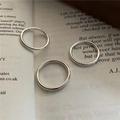 Minimalist S925 sterling silver ring set of three shown on vintage book pages - Size 18 / Diameter 2mm / Silver