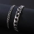 Set of two silver Cuban link chains in 4mm and 8mm widths on a minimalist display - Silver