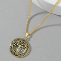 Macro shot of gold Tree of Life pendant featuring intricate Celtic knot patterns on box chain - Gold