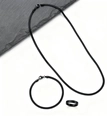 Flat lay of black stainless steel snake chain jewelry set with necklace bracelet and ring - Three-Piece Set / Black