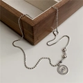 Detail of vintage silver elephant coin pendant with heart accents on mixed chain necklace - 925 Silver / Antique Silver