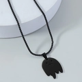 Cartoon ghost pendant necklace in matte black stainless steel on a white podium - Black