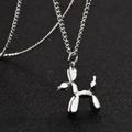 Polished silver balloon dog pendant necklace for men and women on a sleek black background - Steel