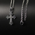 Collana con pendente a croce traforata in argento con zirconi su trama nera opaca - Collana con croce vuota
