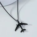 Macro detail of matte black airplane pendant necklace with smooth metallic wings - Black