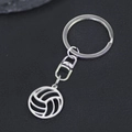 Macro shot of silver hollow volleyball pendant with stainless steel keychain hardware - Silver