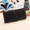 Detail of long black pebble leather wallet with white stitching and pink interior lining - Black