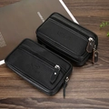 Detailed macro view of black lychee grain leather waist bag with metal zipper and logo - Single Layer 6.3 Inch Black