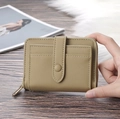 Detail of khaki leather mini purse with zipper compartment and snap button card holder - Khaki
