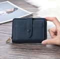 Close-up of navy blue leather wallet featuring multiple card slots and secure buckle clasp - Dark Blue