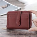 Burgundy litchi grain coin purse with zipper and multiple card slots held in hand - Burgundy