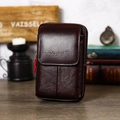 Detail of dark brown leather phone holster with brand logo and vintage styling - Vertical Flap Leather