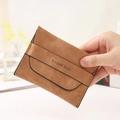 Brown frosted leather card wallet with Elegant Style text held in hand for size display - Coffee