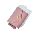 Detail of pink quilted faux leather wallet with triangle pendant and decorative tassel - Deep Pink