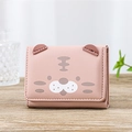 Pink trifold wallet with cartoon cat face and 3D ears on a wooden background - Pink
