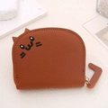 Close-up of brown cat-shaped mini card holder featuring lychee texture and gold zipper - Coffee