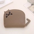 Detail of cat-shaped brown pebble leather wallet with ear design and tail zipper pull - Light Coffee Grey