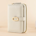 Detail of lychee pattern leather wallet with golden zipper and metal ring buckle - White