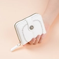 Close-up of white wax leather wallet with hollow cutout design and golden metal buckle detail - White