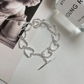 Bracciale S925 argento sterling con maglie a cuore e chiusura a T su sfondo estetico - Argento 925 / Argento (SLU004)