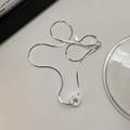 Minimalist S925 sterling silver necklace with textured sand donut pendant on beige surface - XLU040 Silver (5g)