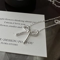 Elegante collana in argento S925 con ciondolo a fiocco intrecciato e catena a maglie classica - Argento 925 / Argento (XLT043)