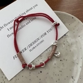 Minimalist red woven string bracelet with silver beads and pendant on ceramic plate - Geometric Red String (12SL43) / 925 Silver