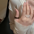 Stackable ring set with brown resin stone and transparent faceted band on model hand - White Crystal