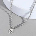 Collana hip hop punk in acciaio inossidabile con ciondolo a teschio e occhi a cuore - Argento