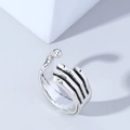 Detail of vintage hip-hop skeleton hand ring with retro black finish and adjustable band - Adjustable Open / Silver