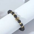 Men's lava stone beaded bracelet with golden Spartan helmet charm and metal spacers - Lava Stone
