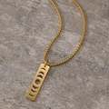 Detailed close-up of golden stainless steel sun and moon phase hollow pendant on chain - Gold