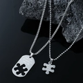 Poliertes Edelstahl-Puzzle-Halsketten-Set für Paare auf schwarzem Lavagestein - Silber