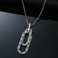 Silver layered oval pendant necklace with screw patterns and crystal pavé on black background - Silver