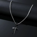 Detailed view of men's stainless steel cross necklace on a black display stand - Black and White