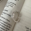 Minimalist S925 sterling silver U-shaped open ring with geometric textured surface on a book - Adjustable Open / Geometric Texture Style (JZX030)