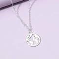 Silver world map necklace with hollow circular pendant on a purple minimalist background - Silver