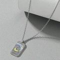 Macro view of silver tarot necklace pendant showing the Empress III card with colorful enamel - The Empress